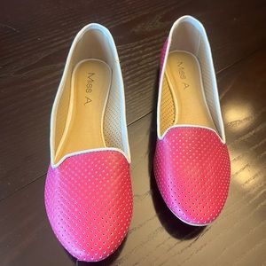 Miss A hot pink perforated loafers with white trim.